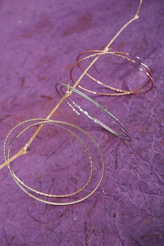 THIN DIAMOND CUT TUBULAR ENDLESS HOOP EARRINGS | 52E2081735