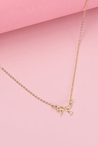 MINI GOLD BOW CHARM NECKLACE | 80N346