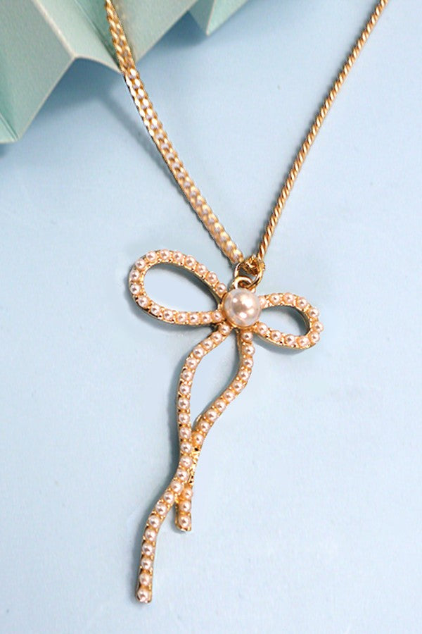 PEARL EMBELLISHED BOW PENDANT NECKLACE | 31N24080