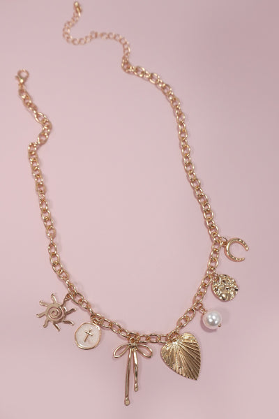 SUN BOW PEARL CROSS DISC U CHARM NECKLACE | 80N1182