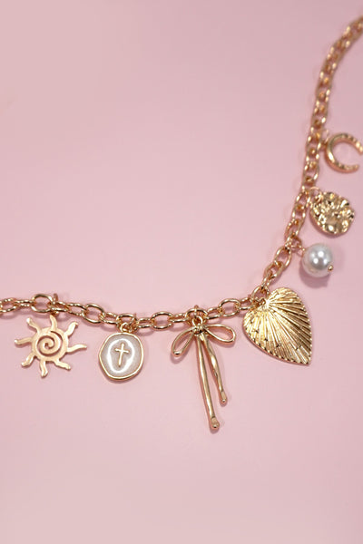 SUN BOW PEARL CROSS DISC U CHARM NECKLACE | 80N1182