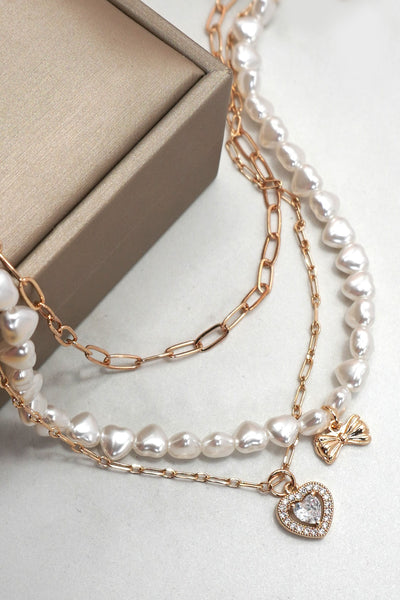 MULTI PEARL LAYER SET BOW HEART PENDANT NECKLACE | 25N942