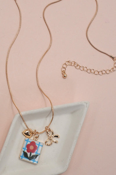PORCELAIN CLUSTER CHARM BOW HEART NECKLACE | 80N91840