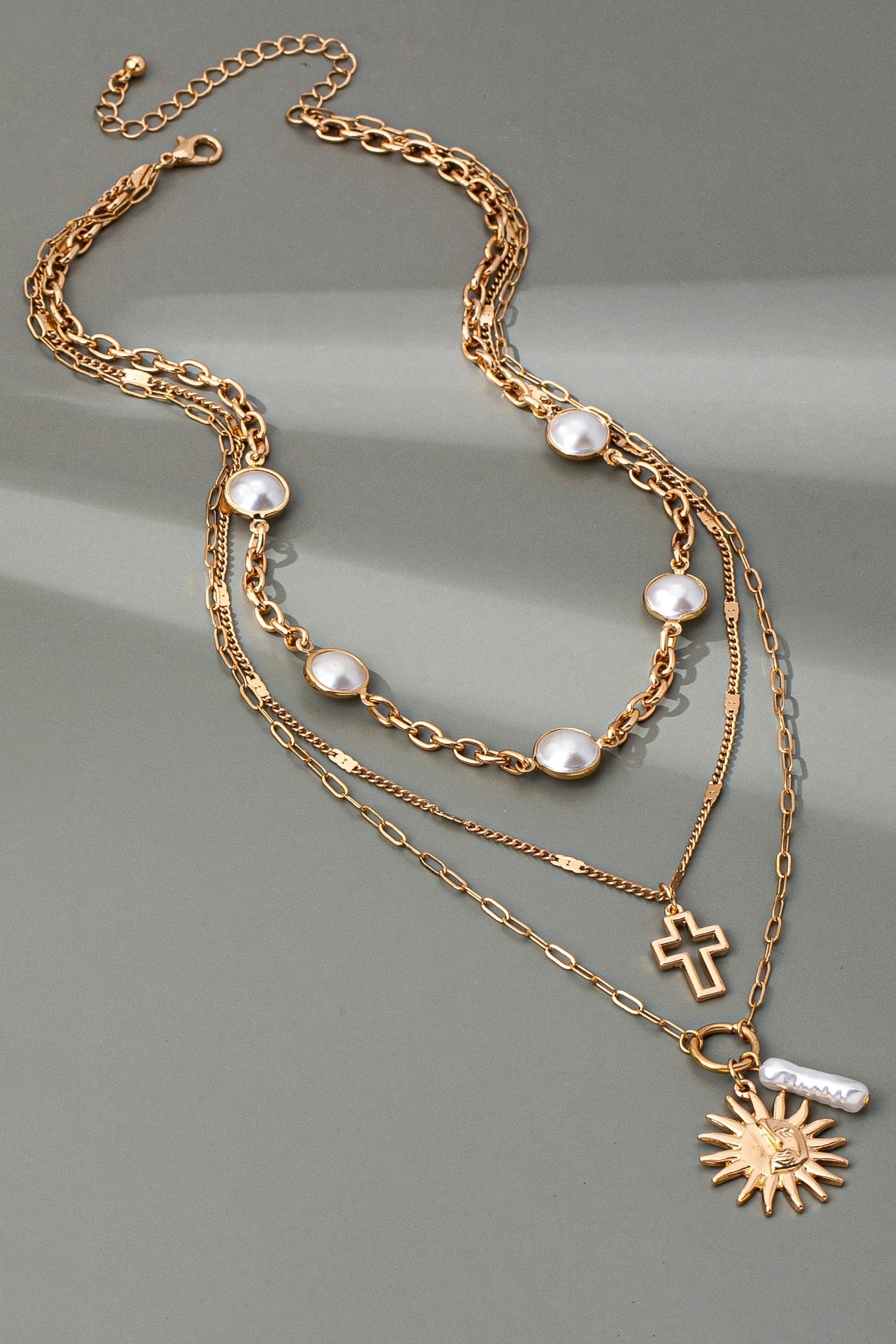 MULTI PEARL LAYER PEARL SUN CROSS CHARM NECKLACE | 80N92503