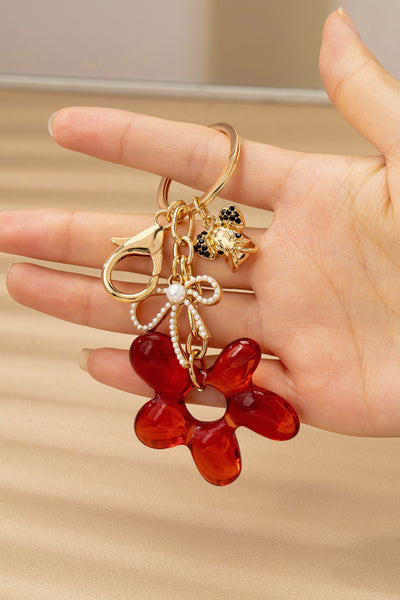 BAG CHARM KEY CHAIN-RESIN FLORAL BOW DOG | 80K091