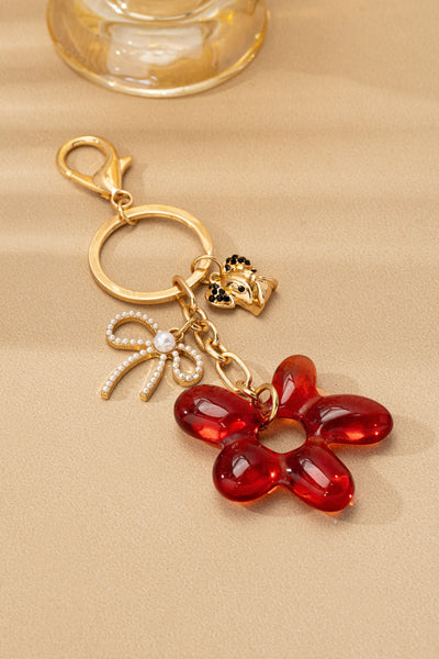 BAG CHARM KEY CHAIN-RESIN FLORAL BOW DOG | 80K091