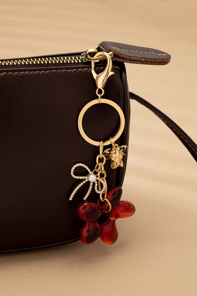 BAG CHARM KEY CHAIN-RESIN FLORAL BOW DOG | 80K091