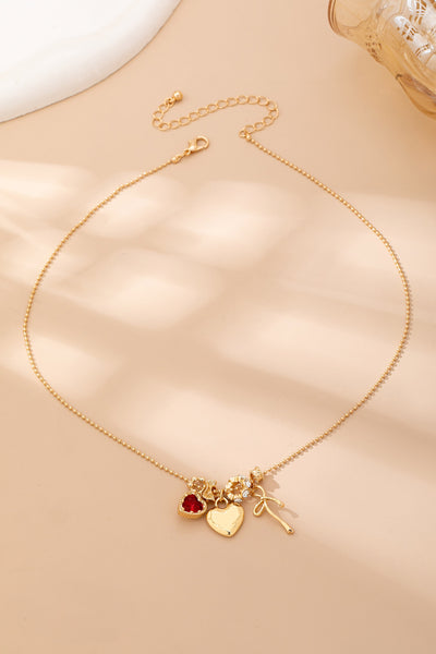 Multi-Charm Heart and Bow Necklace | 80N92882