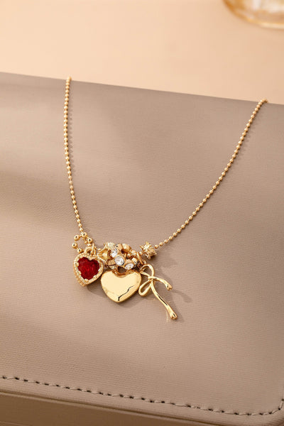 Multi-Charm Heart and Bow Necklace | 80N92882