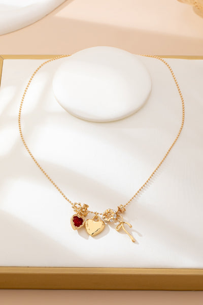 Multi-Charm Heart and Bow Necklace | 80N92882
