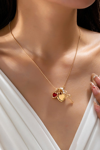 Multi-Charm Heart and Bow Necklace | 80N92882