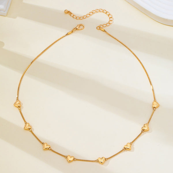 Dainty Gold Puffy Heart Station Necklace | 80N93588